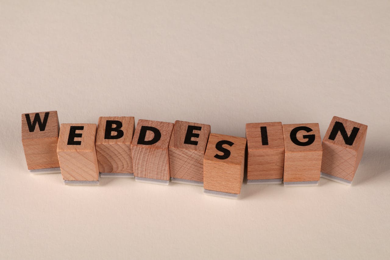 services-03 Wooden blocks spelling 'web design' creatively showcase digital design concept.